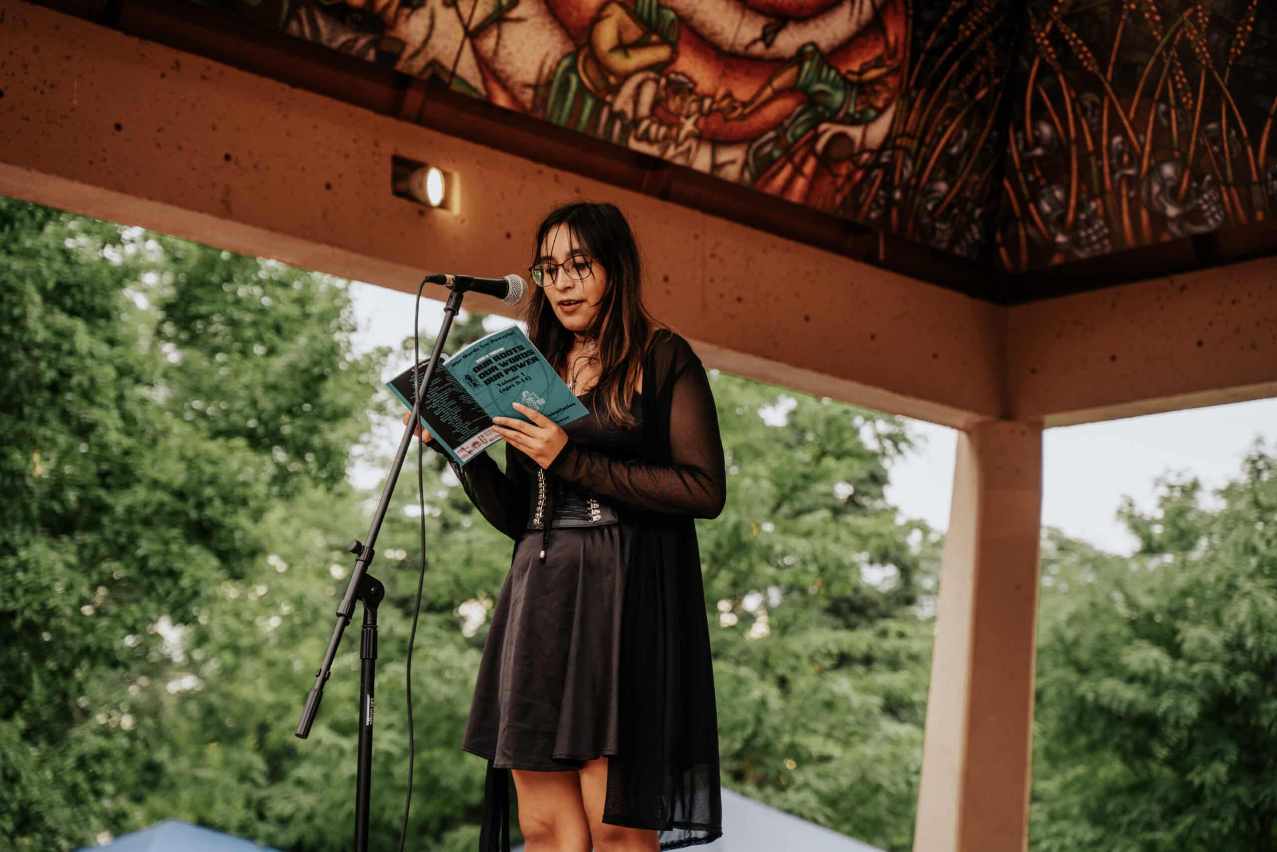 105-_GXV4844 Student reading her poem