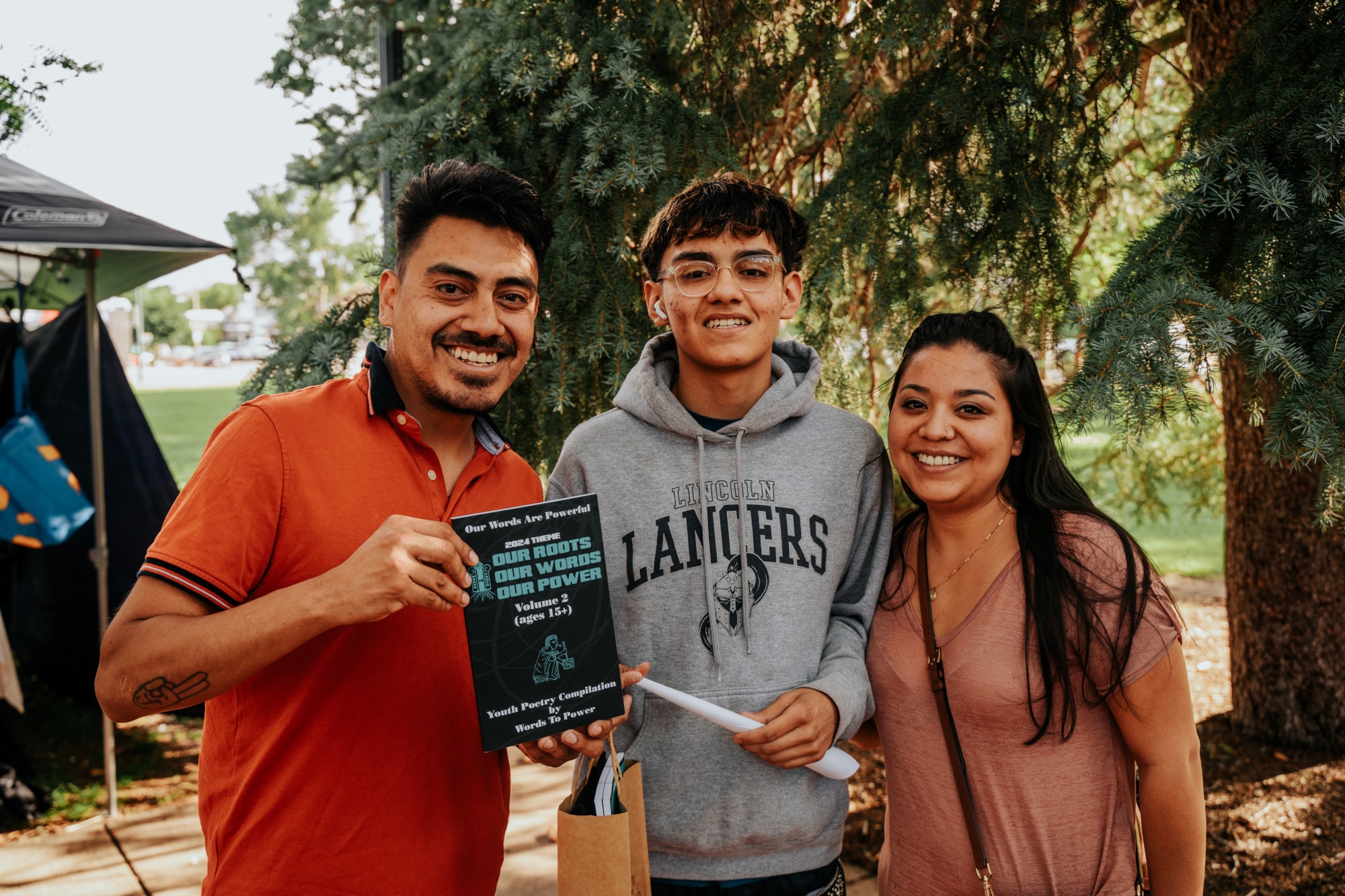7-_GXV4589_reduced Photo of youth with family and book